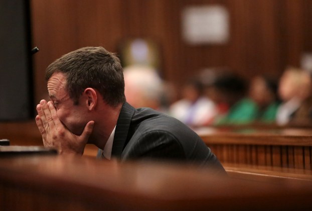 Olympic and Paralympic track star Pistorius reacts in dock during his trial for murder of his girlfriend Steenkamp, at North Gauteng High Court in Pretoria