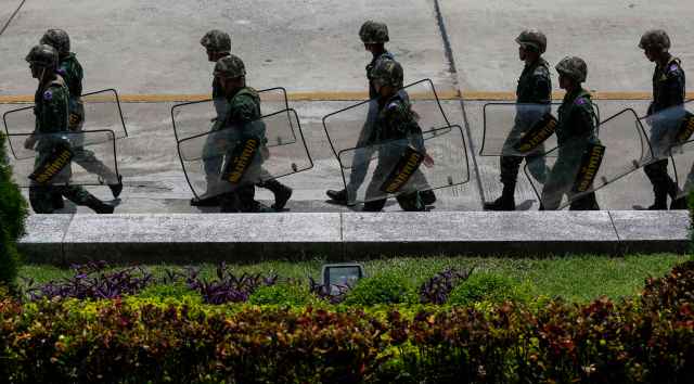 Thai soldiers walk inside a compound of the Army Club after the army declared martial law nationwide to restore order, in Bangkok
