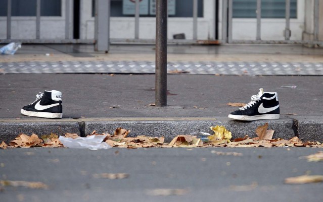 A pair of abandoned shoes seen left in the street near the Bataclan concert hall the morning after a series of deadly attacks in Paris, in this November 14, 2015 file photo.      REUTERS/Charles Platiau/Files
