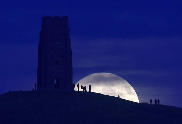 The moon rises near Glastonbury Tor a day before the "supermoon" spectacle, in Glastonbury, Britain November 13, 2016. REUTERS/Rebecca Naden