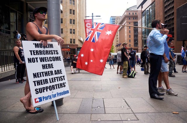 People hold placards and Australian national flags as they attend a rally organised by the right-wing group called Reclaim Australia in central Sydney, Australia, January 29, 2017. REUTERS/Aaron Bunch EDITORIAL USE ONLY. NO RESALES. NO ARCHIVE.