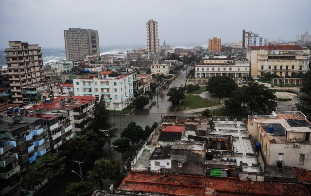 View of flooded streets in Havana during the passage of Hurricane Irma, on September 9, 2017. Irma's blast through the Cuban coastline weakened it to a Category Three, but it is still packing winds of 125 miles (200 kilometer) per hour. / AFP PHOTO / YAMIL LAGE