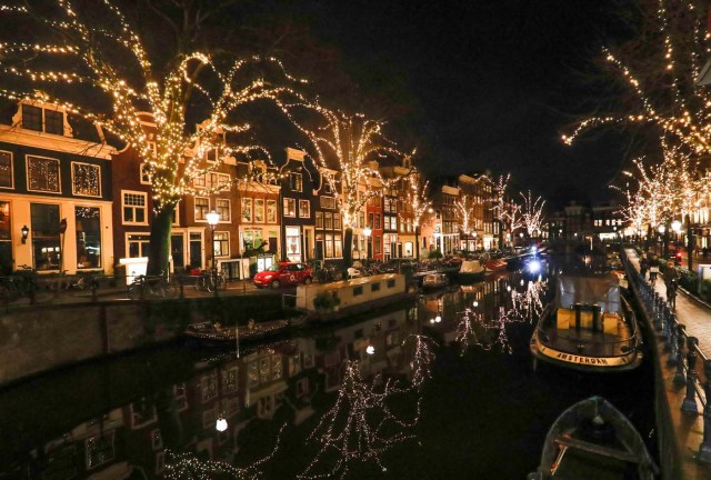 Trees are illuminated near a canal in central Amsterdam, Netherlands, November 30, 2017. Picture taken November 30, 2017. REUTERS/Yves Herman