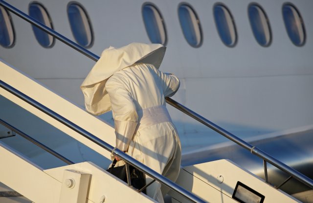 Pope Francis boards for his trip to Chile and Peru at Fiumicino International Airport in Rome, Italy, January 15, 2018. REUTERS/Max Rossi