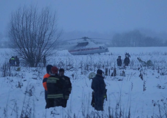 Emergency services work at the scene where a short-haul regional Antonov AN-148 plane crashed after taking off from Moscow's Domodedovo airport, outside Moscow, Russia February 11, 2018. REUTERS/Maxim Shemetov