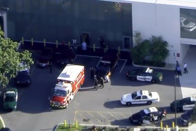 A fire department vehicle containing a man placed in handcuffs by police prepares to unload him at a hospital near Marjory Stoneman Douglas High School following a shooting incident in Parkland, Florida, U.S. February 14, 2018 in a still image taken from a video. WSVN.com via REUTERS. ATTENTION EDITORS - THIS IMAGES HAS BEEN PROVIDED BY A THIRD PARTY. NO RESALES, NO ARCHIVES. MANDATORY CREDIT. NO ACCESS SOUTHEAST FLORIDA MEDIA.