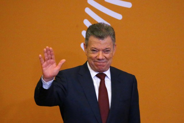 Colombia's President Juan Manuel Santos arrives for the family photo during the VIII Summit of the Americas in Lima, Peru April 14, 2018. REUTERS/ Ivan Alvarado