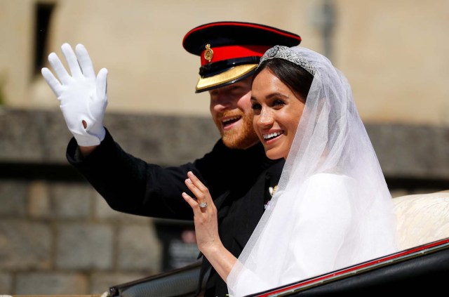Britain's Prince Harry and his wife Meghan Markle ride a horse-drawn carriage, after their wedding ceremony at St George's Chapel in Windsor, Britain, May 19, 2018. REUTERS/Phil Noble/Pool