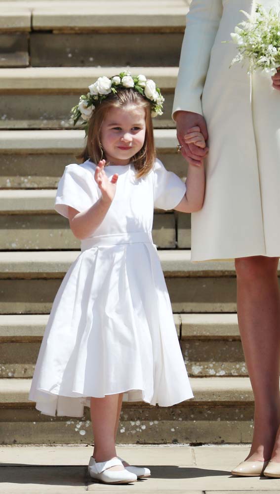 Princess Charlotte on the steps of St George's Chapel in Windsor Castle after the wedding of Prince Harry and Meghan Markle in Windsor, Britain, May 19, 2018. Jane Barlow/Pool via REUTERS